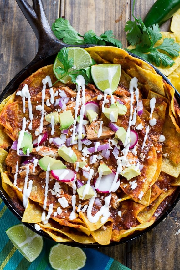 Chicken Chilaquiles with corn tortilla chips, chicken, red chile sauce, and cotija or queso fresco cheese. So good!