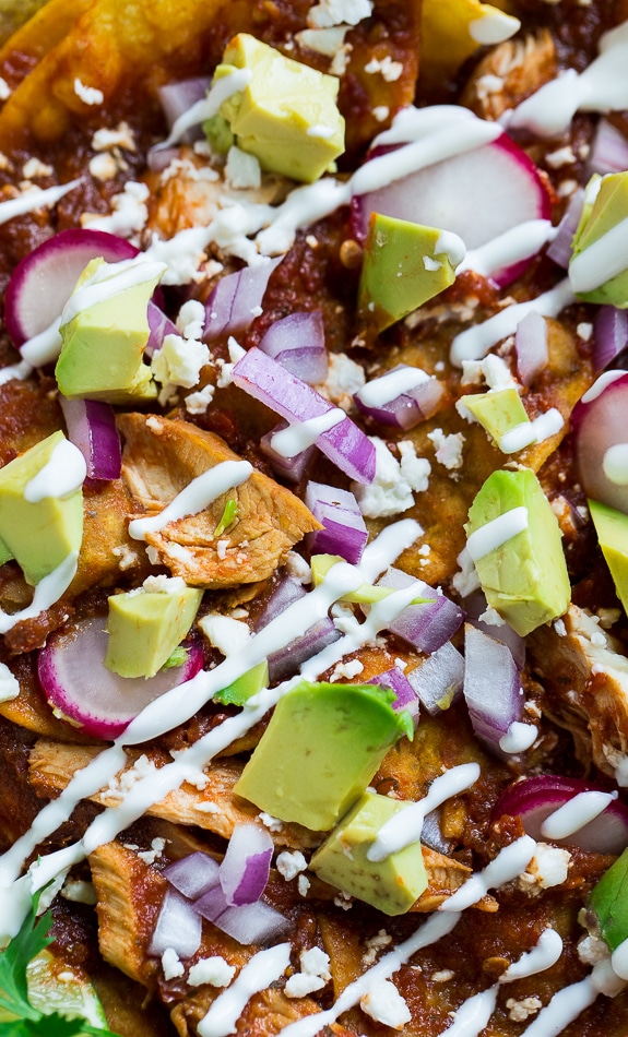 Chicken Chilaquiles with corn tortilla chips, chicken, red chile sauce, and cotija or queso fresco cheese. So good!