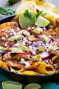 Chicken Chilaquiles with tortilla chips. chicken, red chile sauce, and cotija or queso fresco cheese. So good!