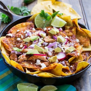 Chicken Chilaquiles with tortilla chips. chicken, red chile sauce, and cotija or queso fresco cheese. So good!