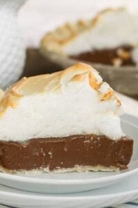 Old-Fashioned Chocolate Meringue Pie slice on a white plate.