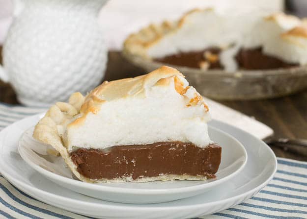 Old-Fashioned Chocolate Meringue Pie slice on a white plate.