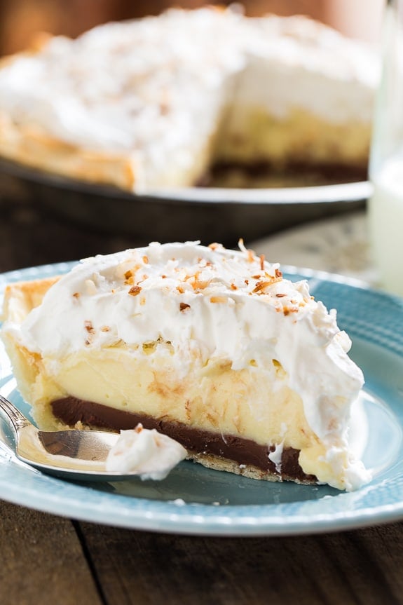 Black Bottom Coconut Cream Pie with a whipped cream topping and toasted coconut.