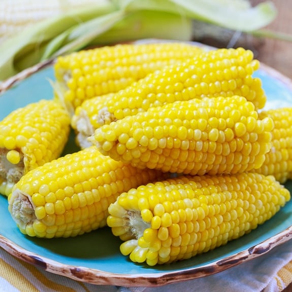 Best Way to Cook Corn- boiled with a stick of butter and a cup of milk.