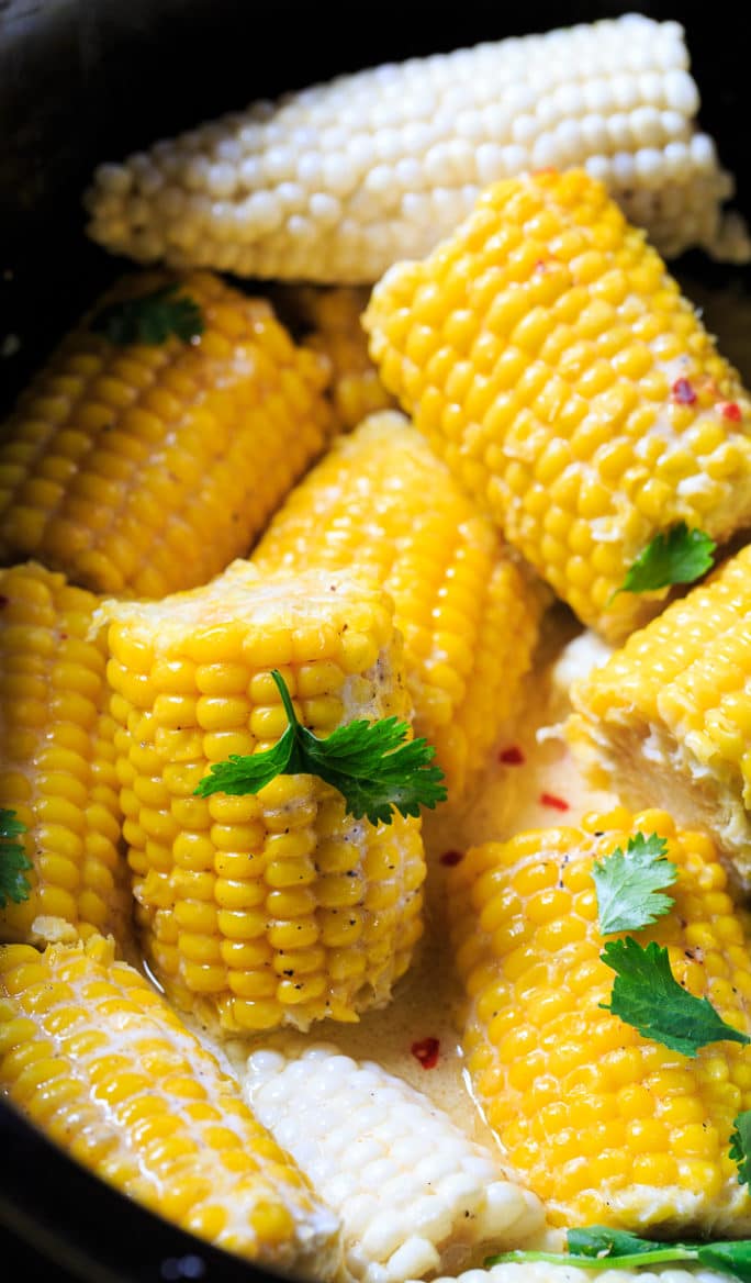 Crock Pot Corn on the Cob cooked with coconut milk and butter.