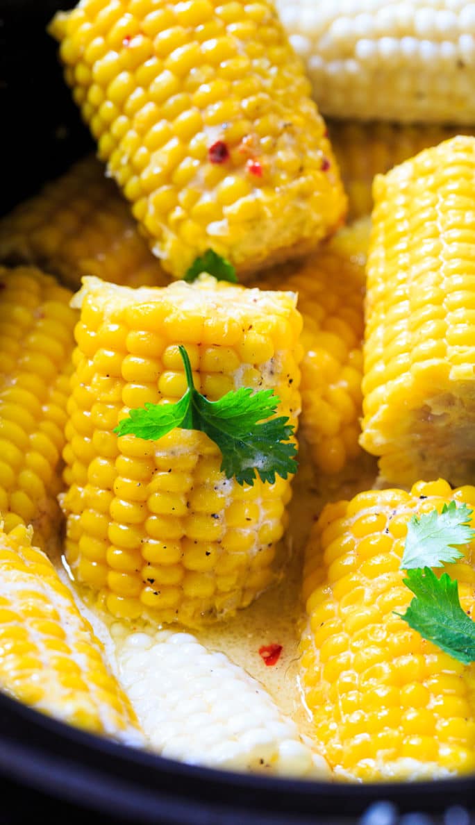 Crock Pot Corn on the Cob cooked with coconut milk and butter.