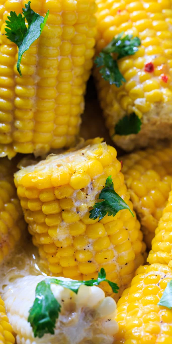 Crock Pot Corn on the Cob cooked with coconut milk and butter.