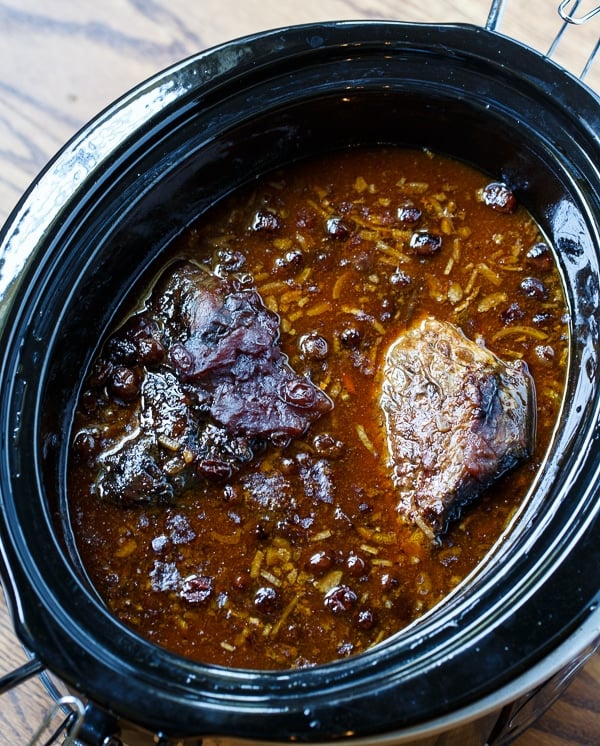 Slow Cooker Pot Roast is super easy and has tons of flavor from dry onion soup mix, tomato sauce, and cranberry sauce.