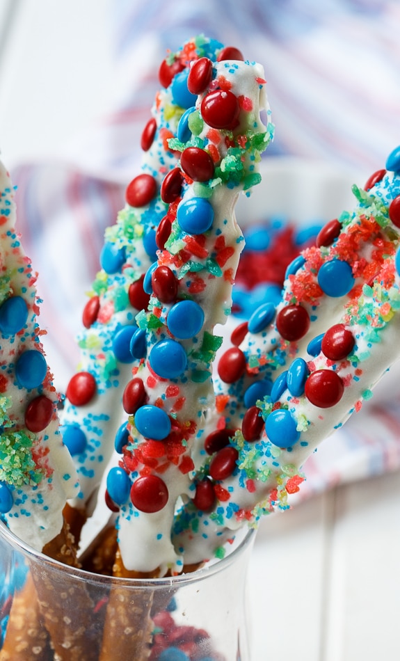 Firecracker Pretzel Rods for the 4th of July. Covered in red and blue M&Ms and Pop Rocks.
