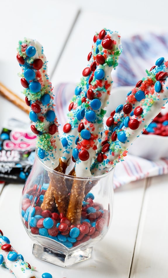 Firecracker Pretzel Rods for the 4th of July. Covered in red and blue mini M&M's and Pop Rocks.