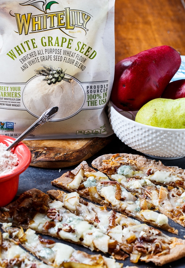 Cheesy Caramelized Flatbread with pears, blue cheese, and pecans. Made with White Lily Premium White Grape Seed Blend Flour.