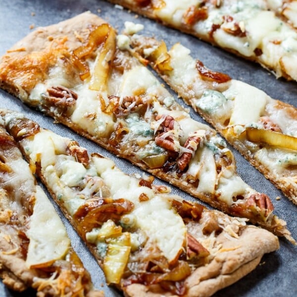 Cheesy Caramelized Onion Flatbreads with pears, blue cheese, and pecans.