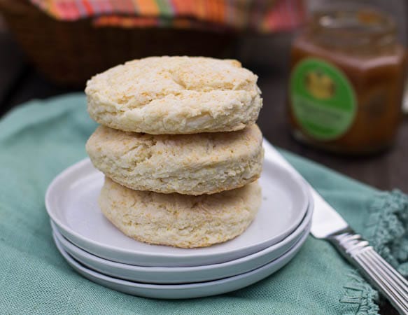 Three Biscuits stacked on small white plates.