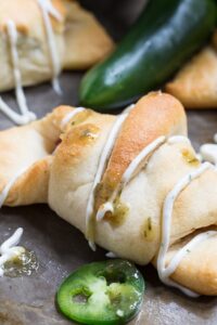 Jalapeno Popper Crescent Rolls - an easy spicy appetizer with cream cheese, bacon, and jalapenos plus spicy Ranch to dip them in.