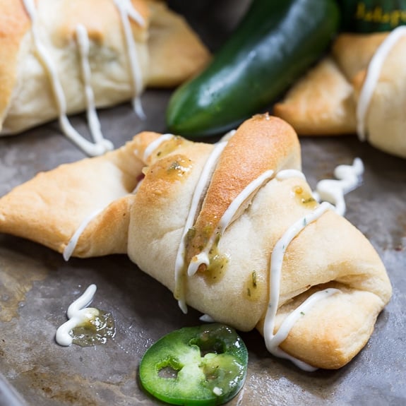 Jalapeno Popper Crescent Rolls - an easy spicy appetizer with cream cheese, bacon, and jalapenos plus spicy Ranch to dip them in.