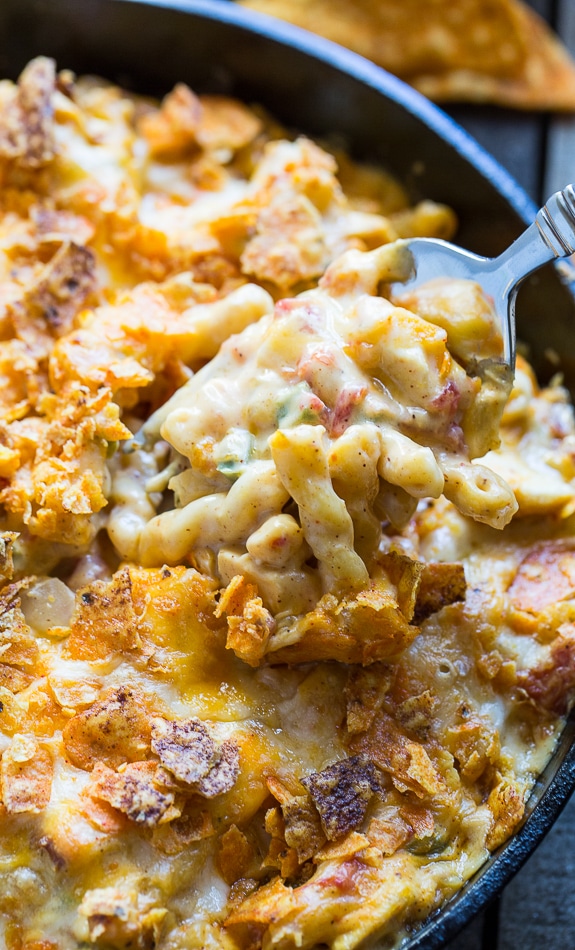 King Ranch Casserole in mac and cheese form. Creamy and spicy with diced chicken and a crushed dorito topping.