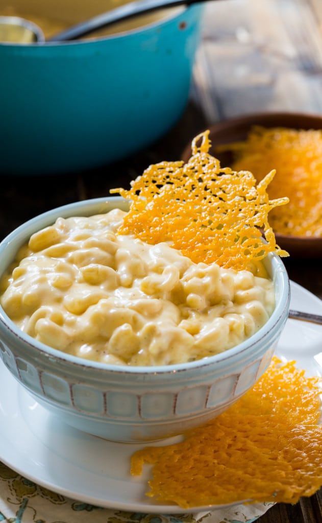 Stovetop Mac and Cheese in a bowl with a cheese crisp stuck into it.
