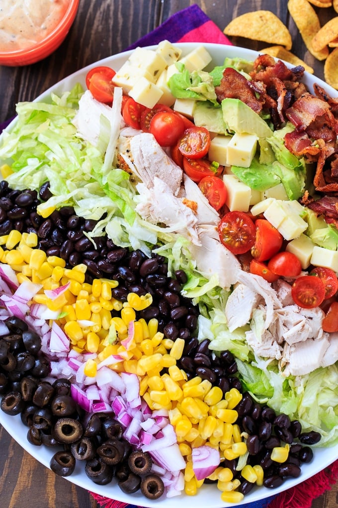 Tex-Mex Cobb Salad with black beans, corn, avocado, bacon, chicken, and frito corn chips