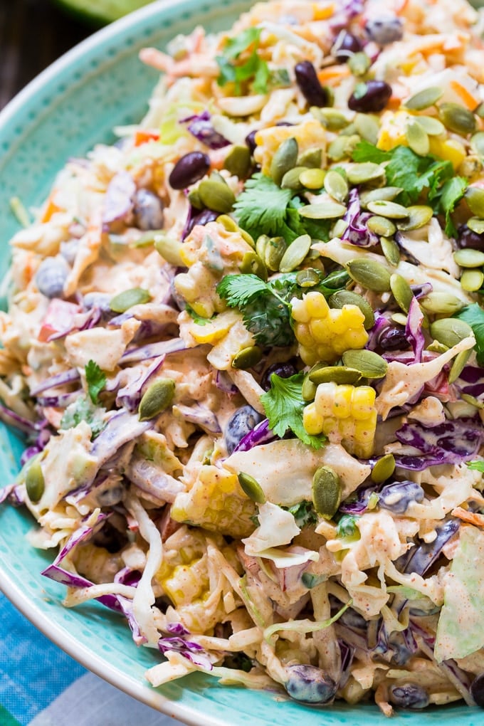Mexican-style Coleslaw with corn, black beans, and taco seasoning.