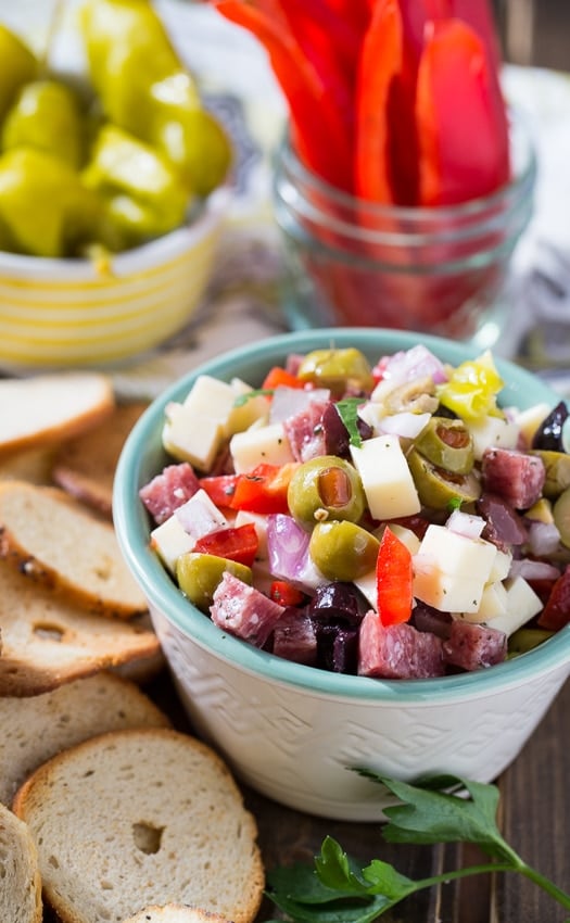 Muffaletta Dip with salami, cheese, and olives. An easy make ahead party food.