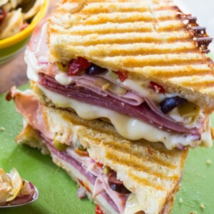 Muffaletta Panini with 3 kinds of meat, provolone cheese, and olive relish.