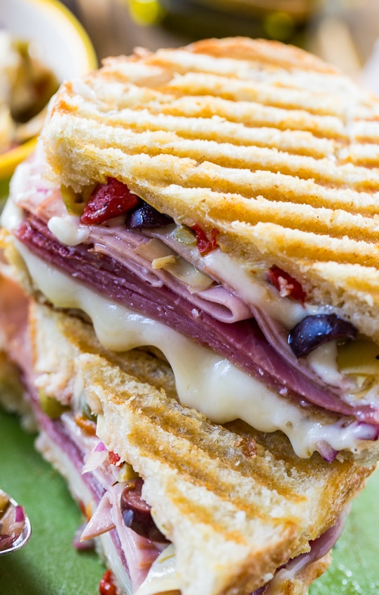 Muffaletta Panini with 3 types of meat, provolone cheese, and olive relish.