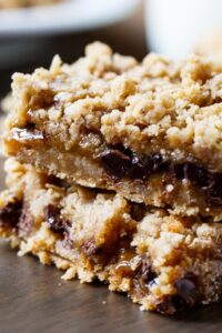 Oatmeal Carmelitas - chocolate chips and caramel sandwiched between oatmeal cookie dough layers.