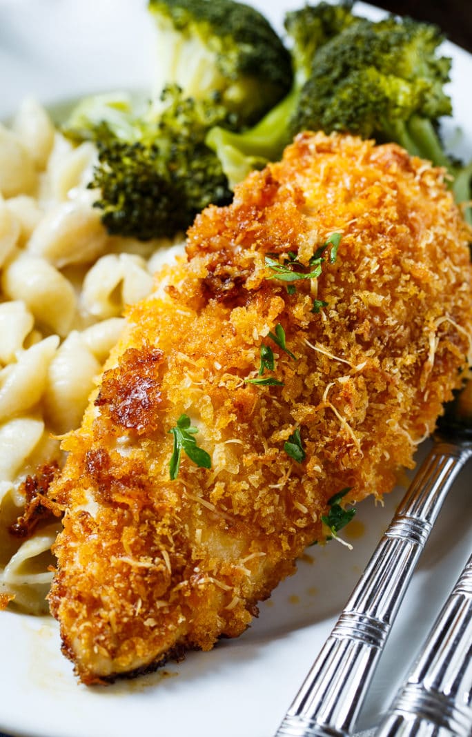 Baked Parmesan Chicken is coated in mayonnaise and then parmesan cheese and Panko crumbs. The most delicious baked chicken!