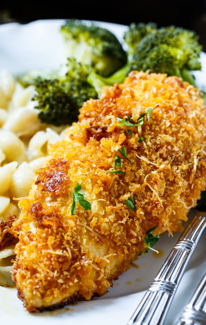 Baked Parmesan Chicken is coated in mayonnaise and then parmesan cheese and Panko crumbs. The most delicious baked chicken!