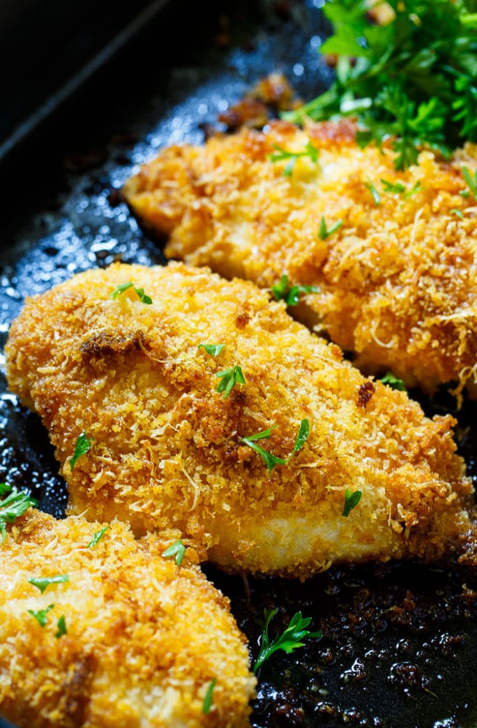 Baked Parmesan Chicken is coated in mayonnaise and then parmesan cheese and Panko crumbs. The most delicious baked chicken!