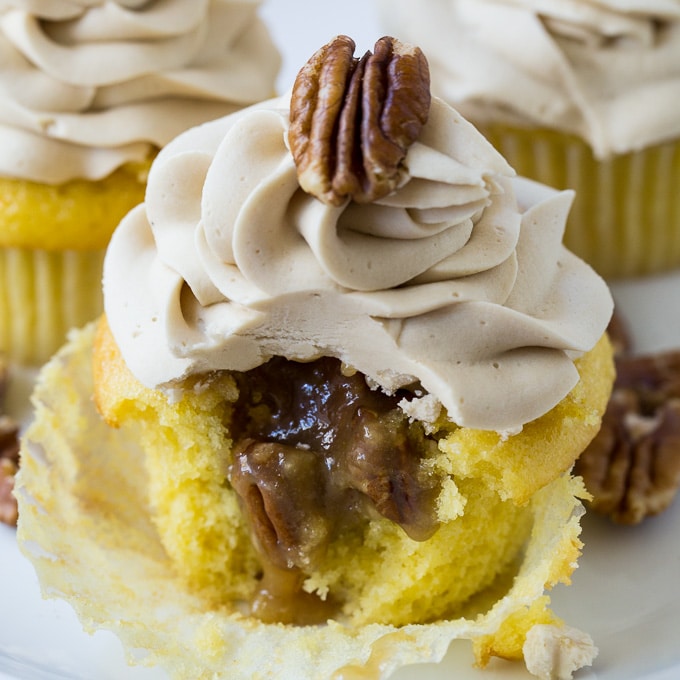 Pecan Pie Cupcake with a bite bitten put to show inside.