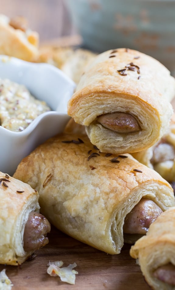 German-Style Pigs in a Blanket with bratwurst, mustard, and kraut.