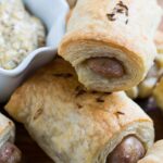 German-Style Pigs in a Blanket with bratwurst, mustard, and kraut.