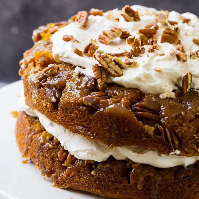 Pumpkin Praline Torte on a white cake stand.