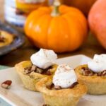 Pumpkin Pecan Tassies in a sugar cookie crust