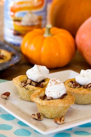 Pumpkin Pecan Tassies in a sugar cookie crust