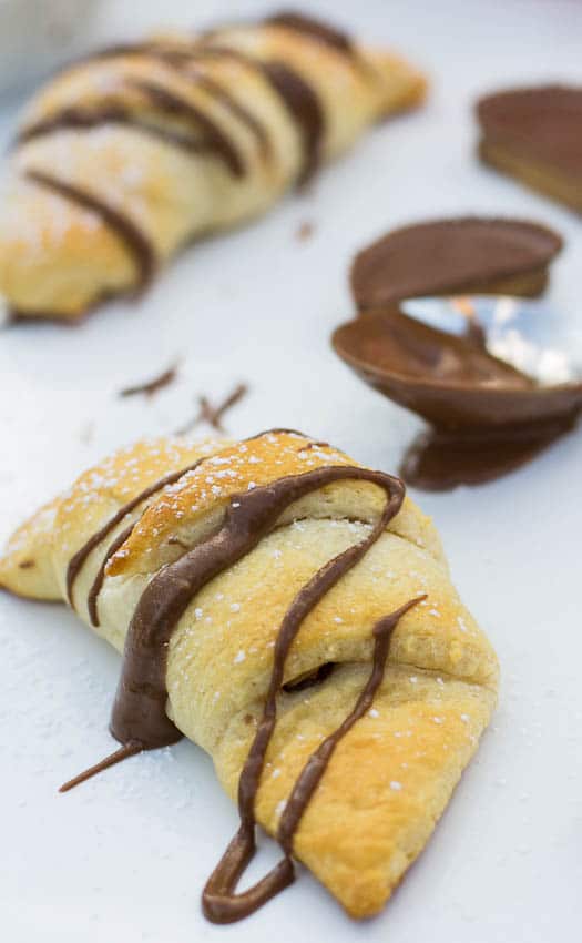 Crescent roll drizzled with chocolate.