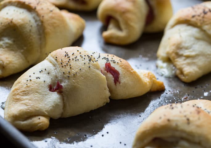 Reuben Crescent Rolls - crescent rolls stuffed with corned beef, swiss cheese, kraut, and thousand island dressing.