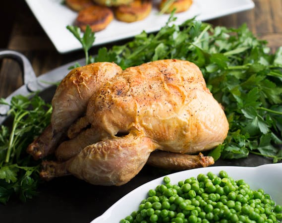 Whole Roast Chicken on bed of parsley.