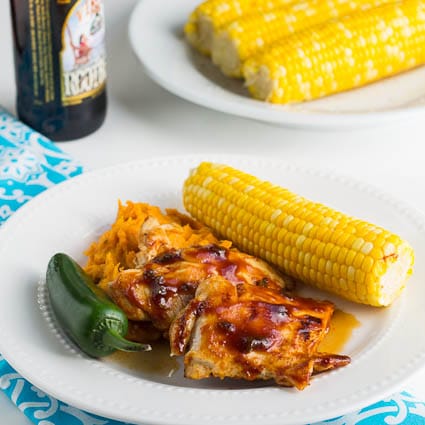 Root Beer Glazed Chicken on a plate with corn.