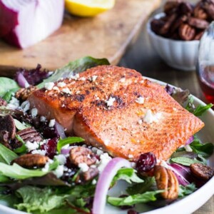 Seared Salmon over Mixed Greens with Dried Cranberries, Feta, and Candied Pecans