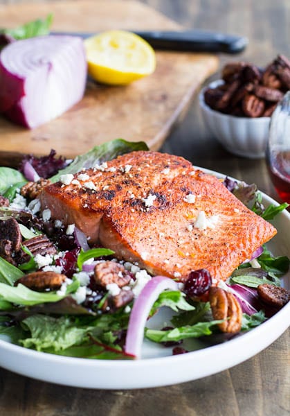 Seared Salmon over Mixed Greens with Dried Cranberries, Feta, and Candied Pecans