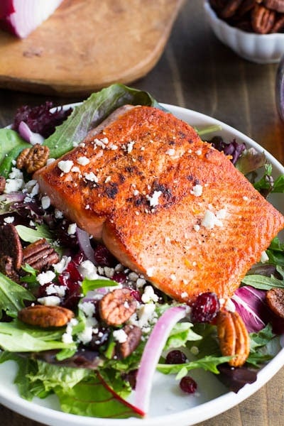Seared Salmon with Mixed Greens over Dried Cranberries, Feta, and Candied Pecans
