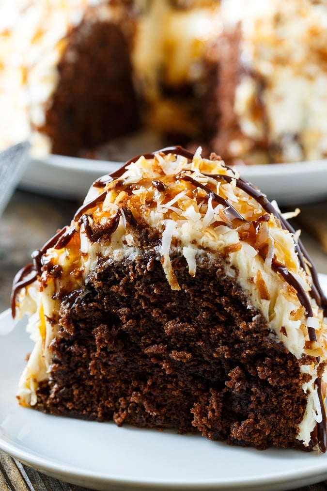 Samoa Bundt Cake- moist chocolate cake covered in caramel frosting and toasted coconut.