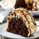 Samoa Bundt Cake- moist chocolate cake covered in caramel frosting and covered in toasted coconut.