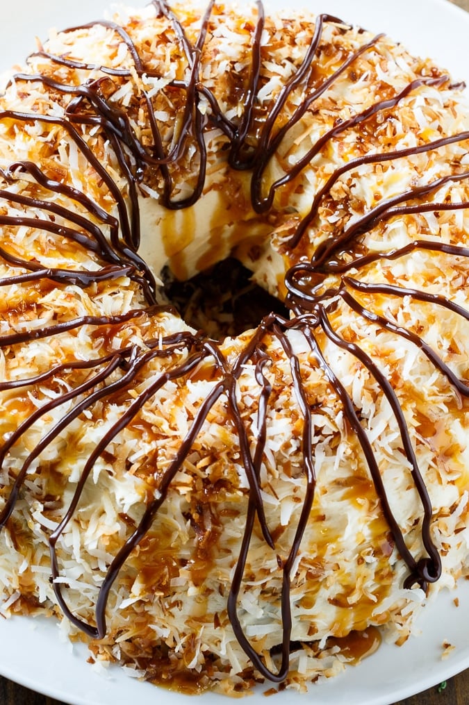 Samoa Bundt Cake- a moist chocolate cake covered in caramel frosting and toasted coconut.