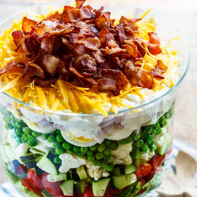 Seven Layer Salad is the perfect salad for potlucks and picnics. Easy to make ahead of time and feeds a crowd.