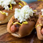 Southern-Style Slaw Dogs with mustard and homemade chili.
