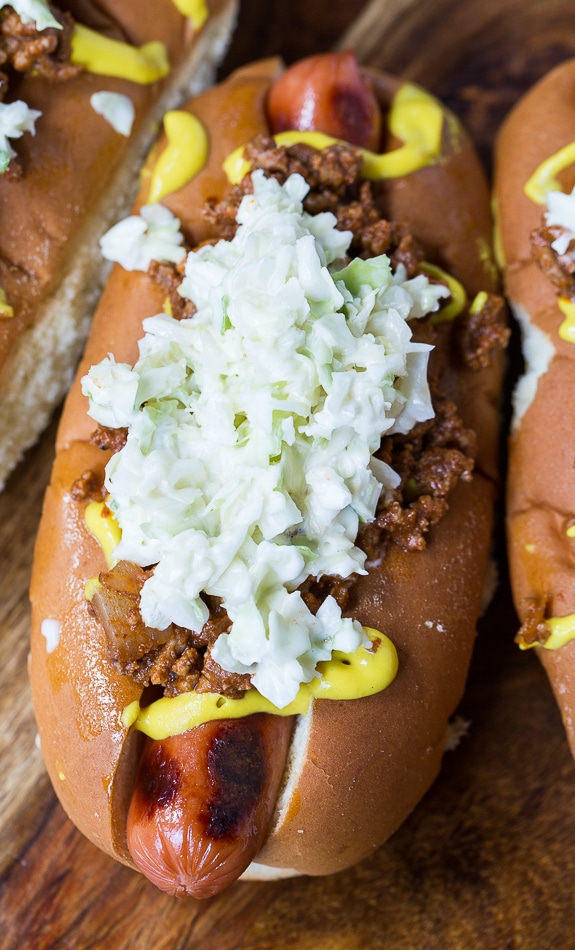 Carolina-Style Slaw Dogs with mustard and homemade chili.