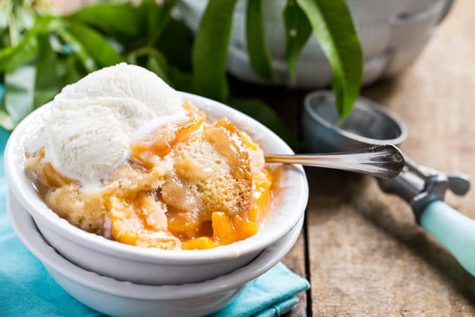 Slow Cooker Peach Cobbler- make with fresh or frozen peaches.